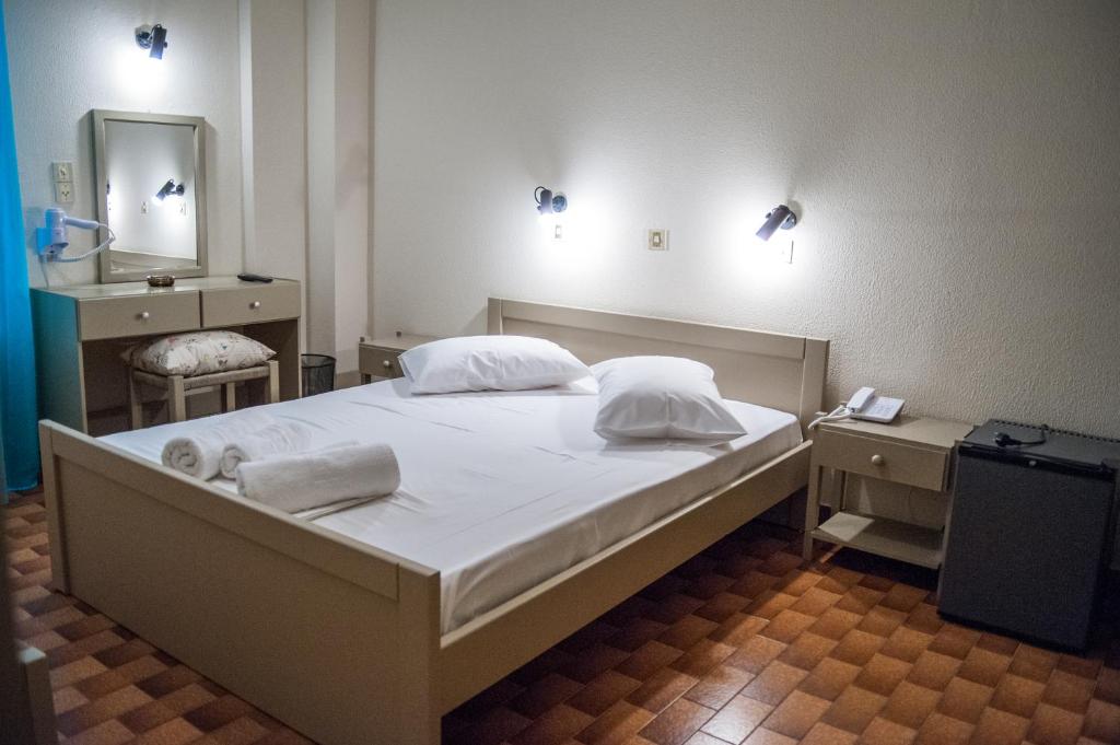 Postel nebo postele na pokoji v ubytování Argostoli Hotel