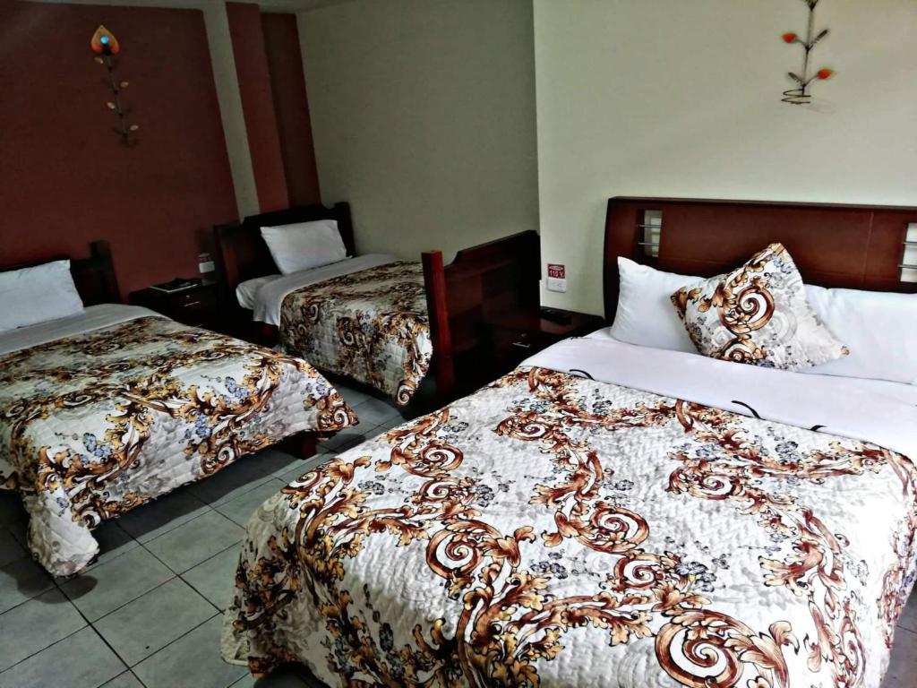 Postel nebo postele na pokoji v ubytování Hostal Mariscal Sucre