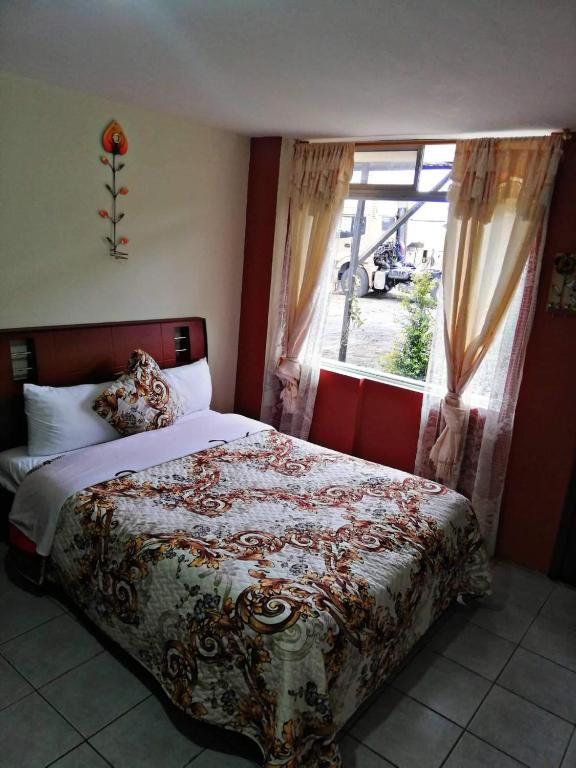 Postel nebo postele na pokoji v ubytování Hostal Mariscal Sucre