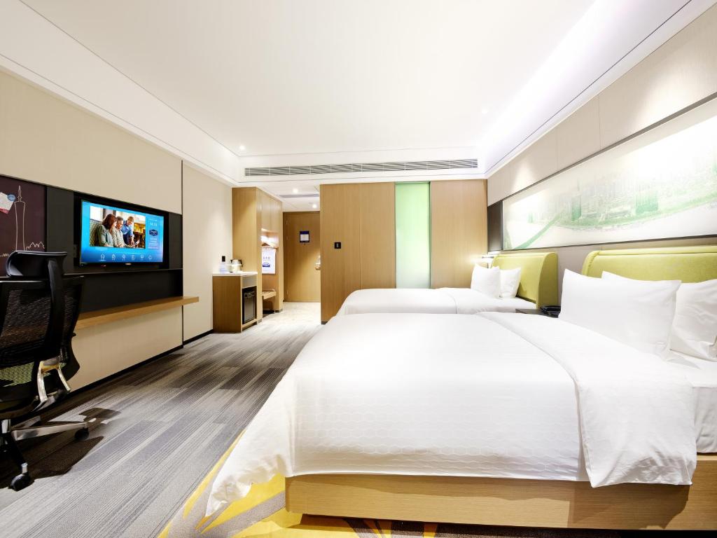 TV a/nebo společenská místnost v ubytování Hampton by Hilton Guangzhou Dongxiaonan