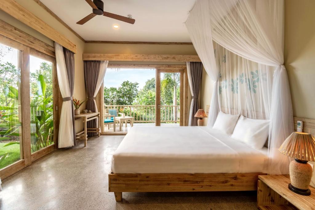 Postel nebo postele na pokoji v ubytování Lahana Resort Phu Quoc & Spa