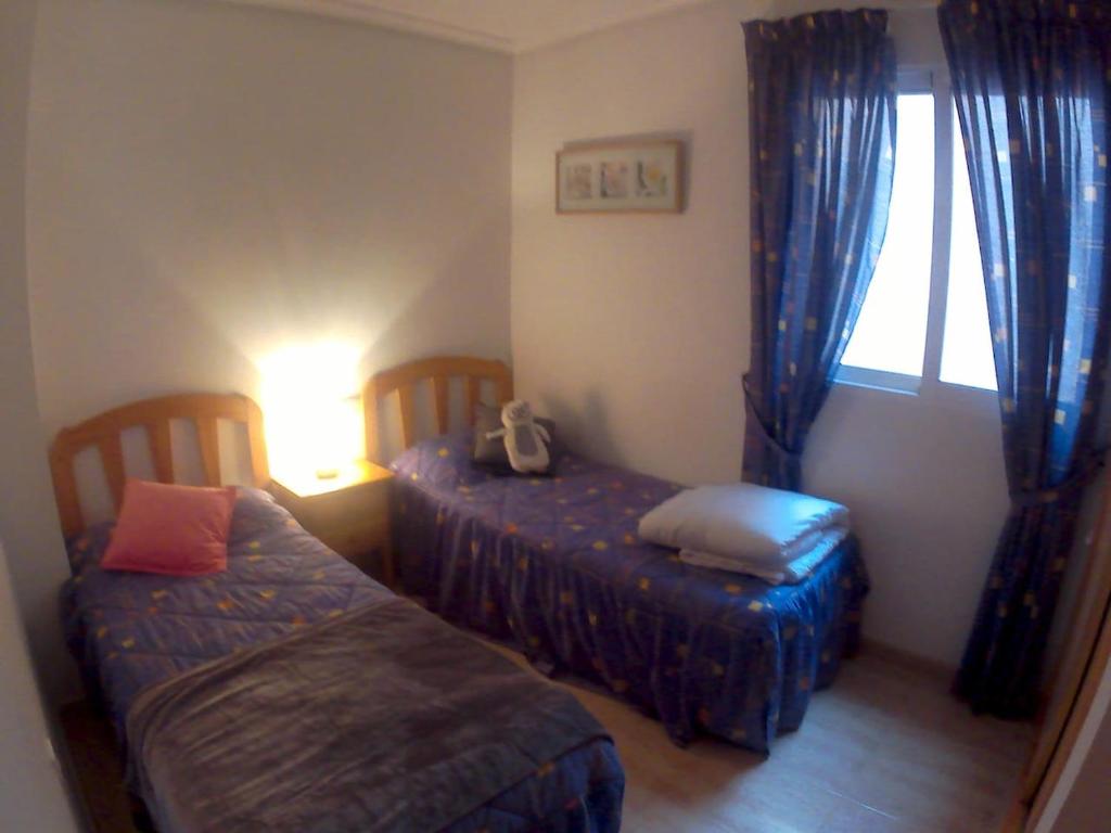 Postel nebo postele na pokoji v ubytování Apartment Vistamar10