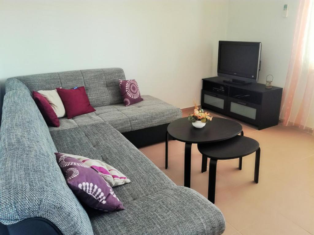 a living room with a couch and a table at Apartment Nevenka in Krk