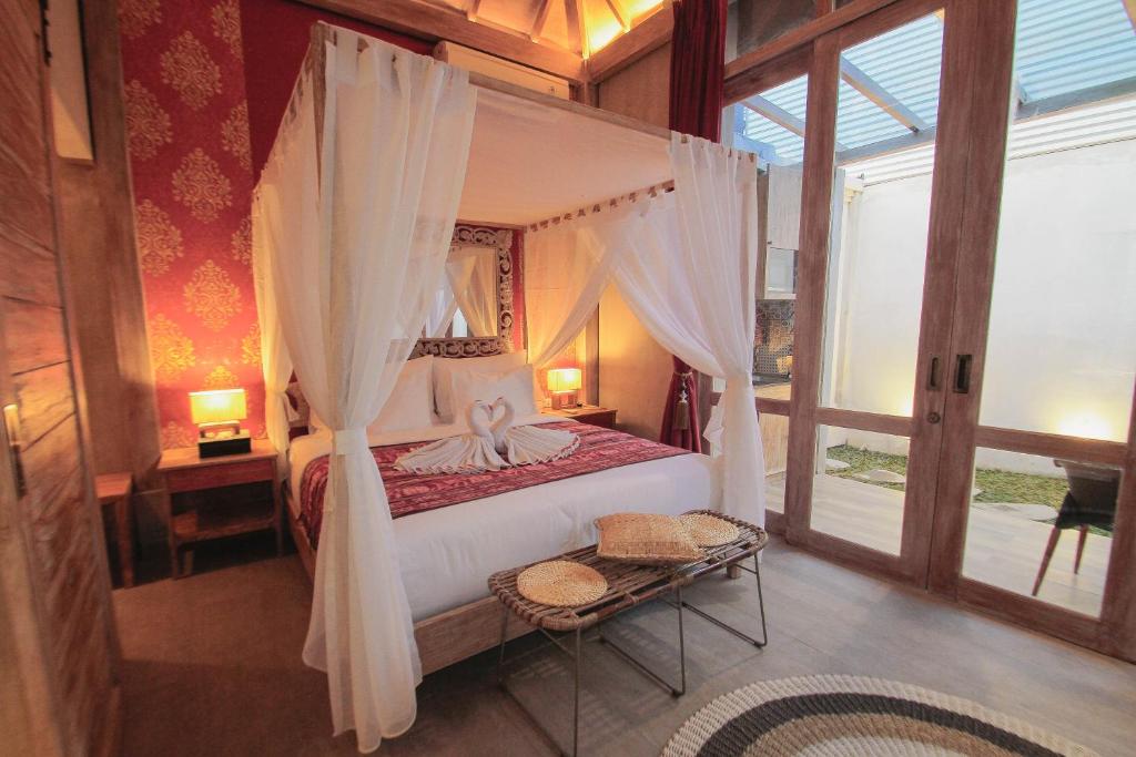 Кровать или кровати в номере 18 Suite Villa Loft at Kuta