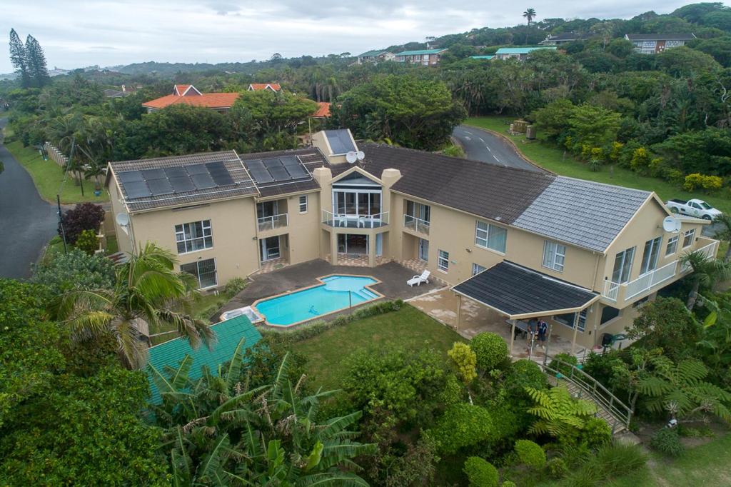 an aerial view of a house with a swimming pool at Ambleside in Port Shepstone