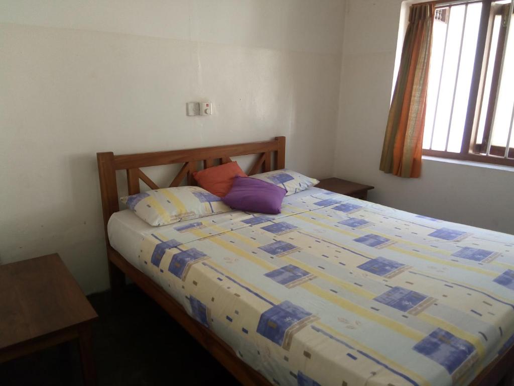 Postel nebo postele na pokoji v ubytování Hotel Mango Garden