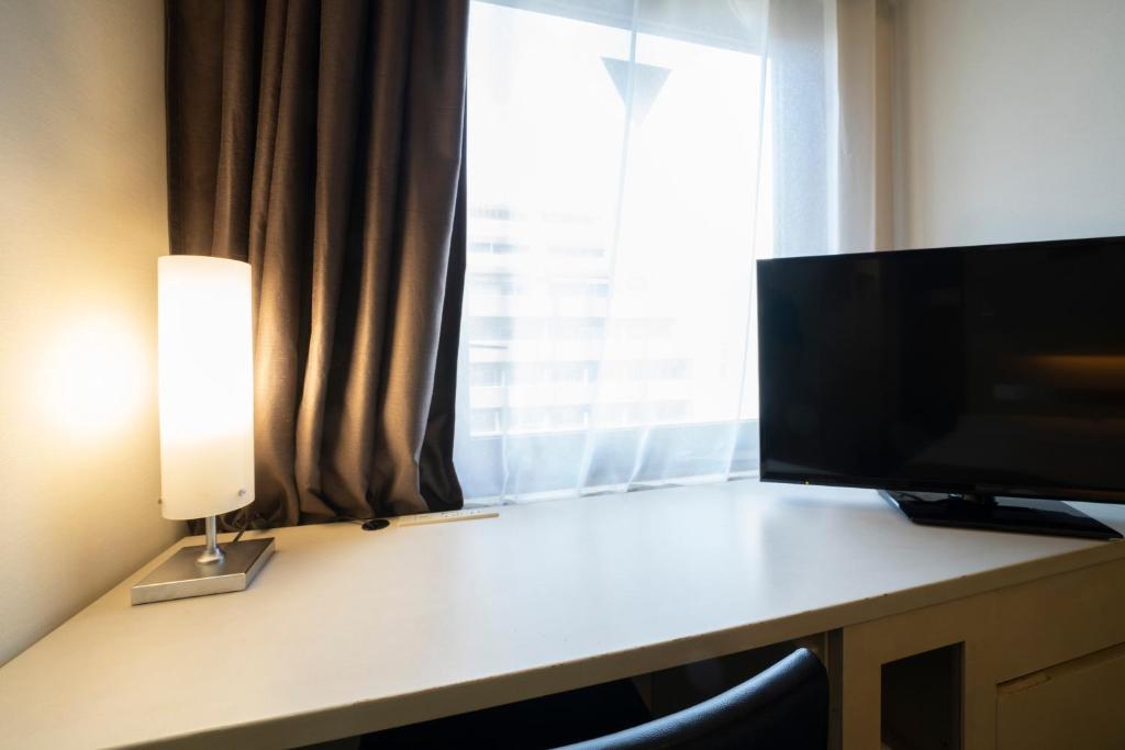 TV a/nebo společenská místnost v ubytování Hotel Binario Umeda