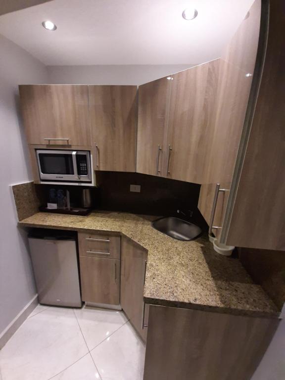 Kuchyň nebo kuchyňský kout v ubytování Nakhil Inn Residence