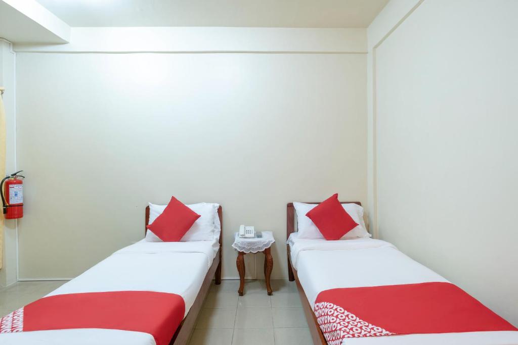 Postel nebo postele na pokoji v ubytování Conrado's Apartelle
