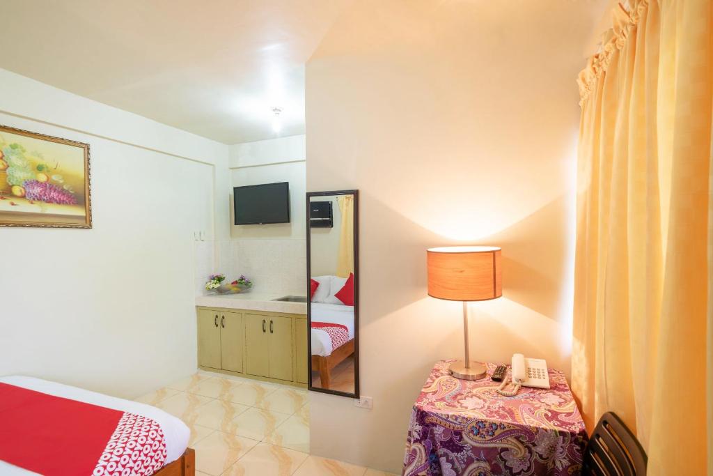 Postel nebo postele na pokoji v ubytování Conrado's Apartelle