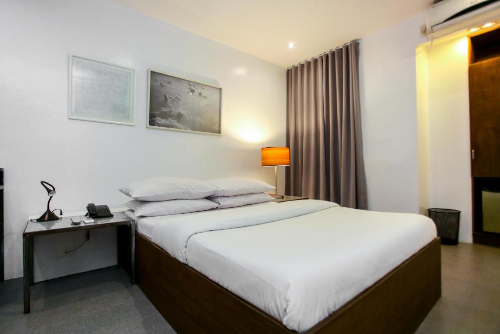 Postel nebo postele na pokoji v ubytování Hotel Durban