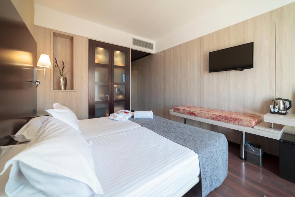 Cama o camas de una habitación en Hotel Salymar