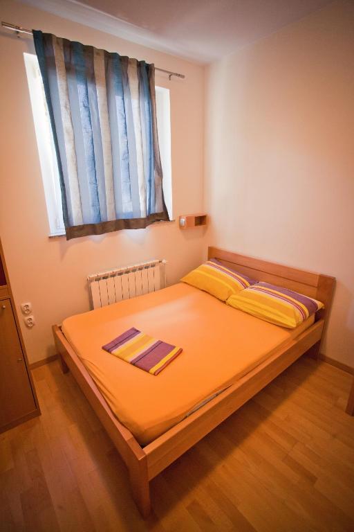 Una cama o camas en una habitación de HI Hostel Zadar