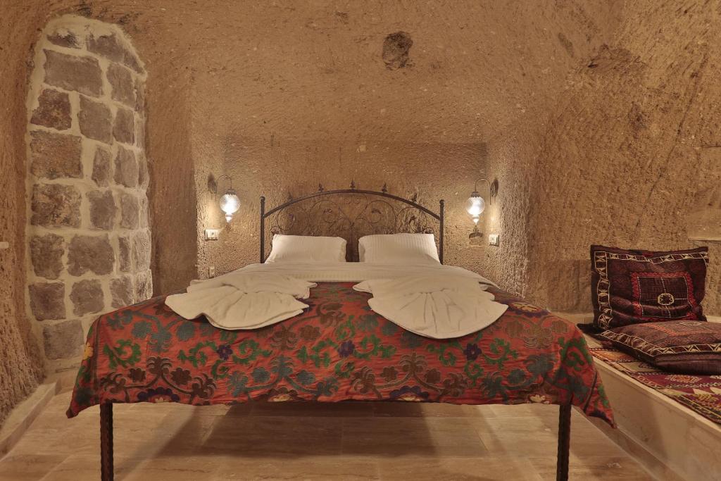 Postel nebo postele na pokoji v ubytování Yoruk Stone House