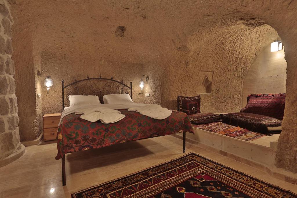 Postel nebo postele na pokoji v ubytování Yoruk Stone House