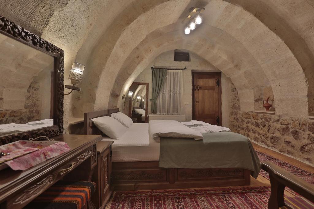 Postel nebo postele na pokoji v ubytování Yoruk Stone House