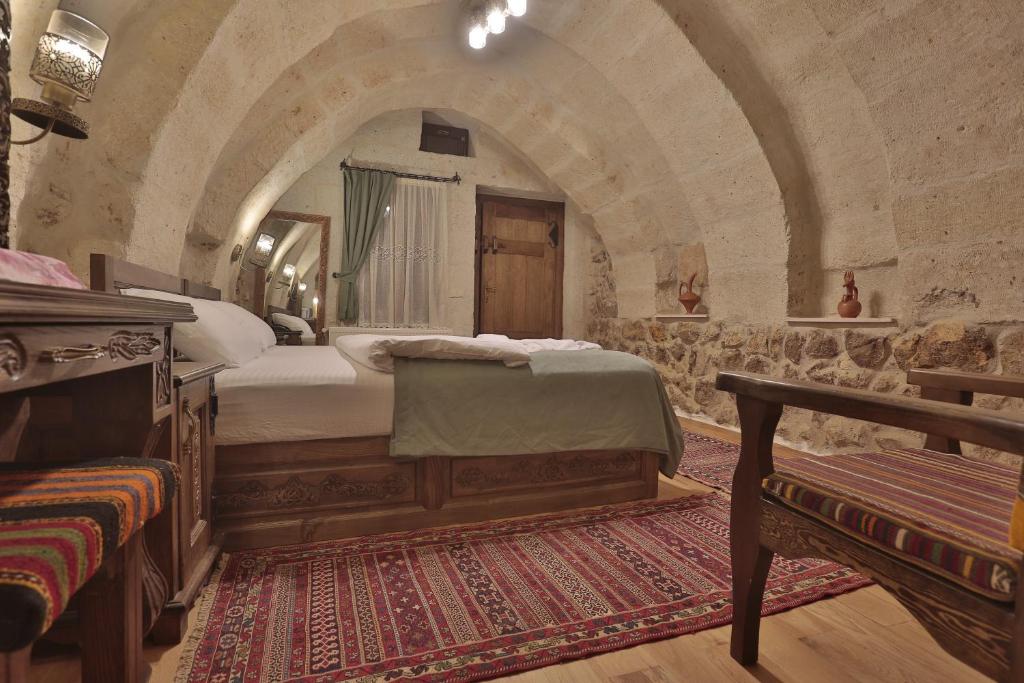 Postel nebo postele na pokoji v ubytování Yoruk Stone House