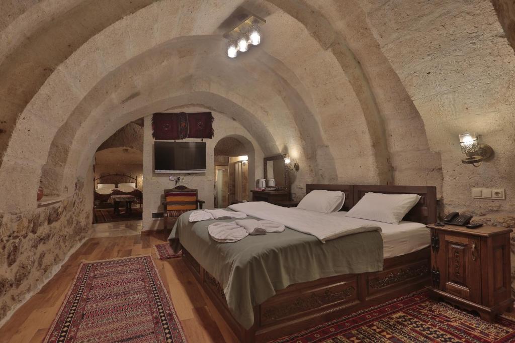 Postel nebo postele na pokoji v ubytování Yoruk Stone House