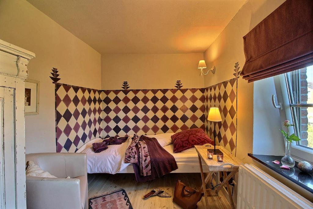 Postel nebo postele na pokoji v ubytování Gîte Le Charme du Passé