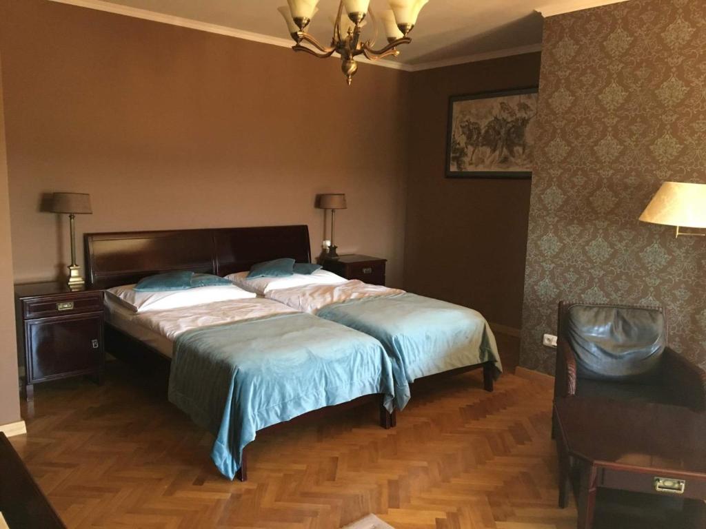 Postel nebo postele na pokoji v ubytování Rezidence Liběchov