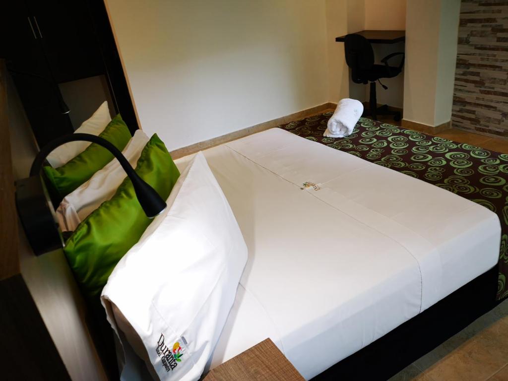 Postel nebo postele na pokoji v ubytování Hotel Boutique Duranta