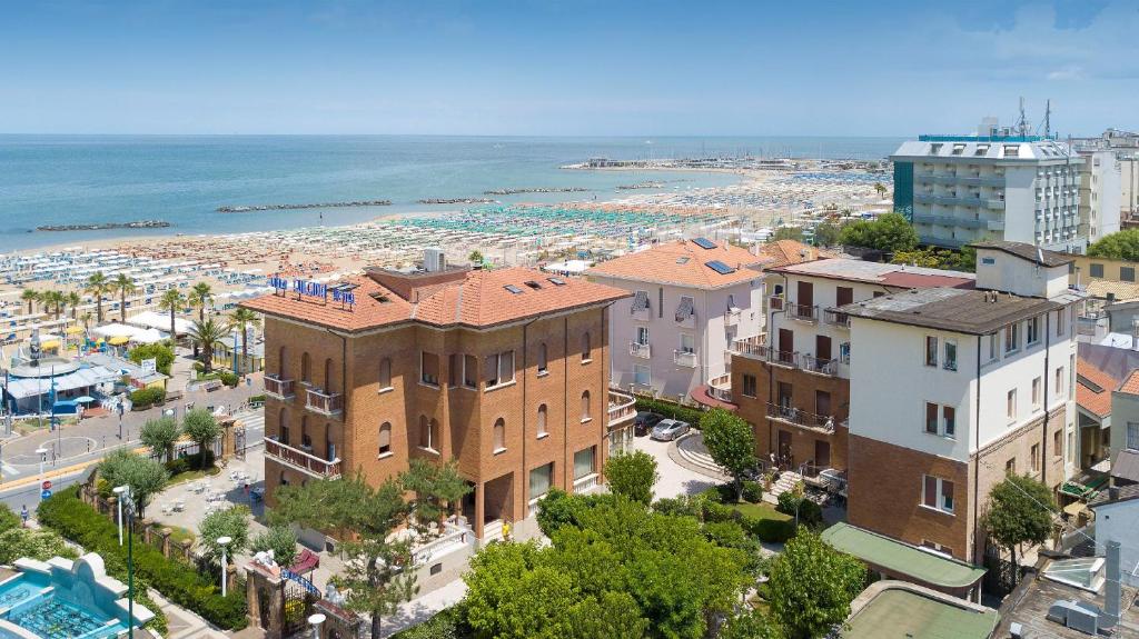 a view of a city with a beach and buildings at Hotel Villa Fulgida in Cattolica