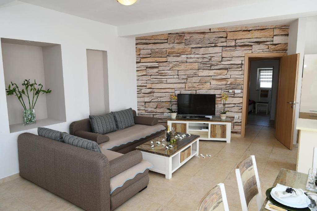 Telewizja i/lub zestaw kina domowego w obiekcie Apartment LIBRA with sea view