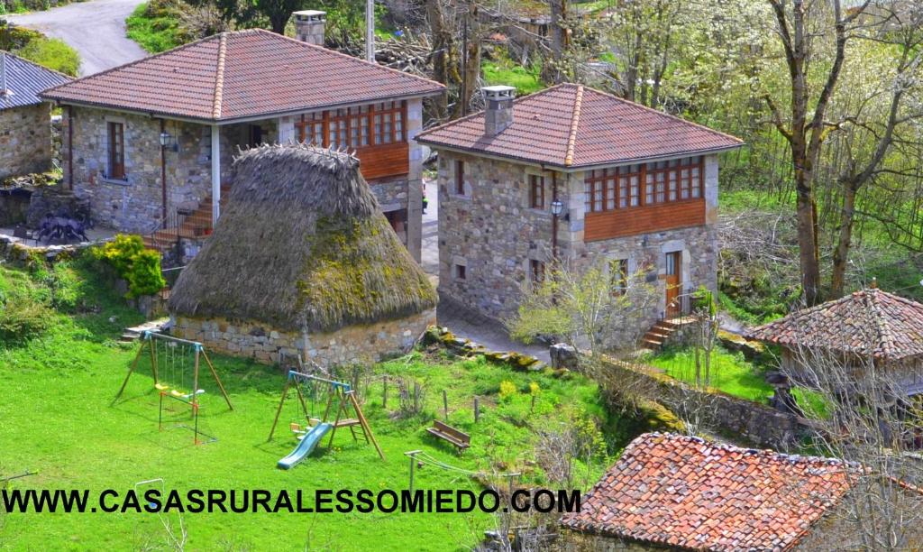 an aerial view of a house with a playground at Casas Rurales Las Corradas in Éndriga