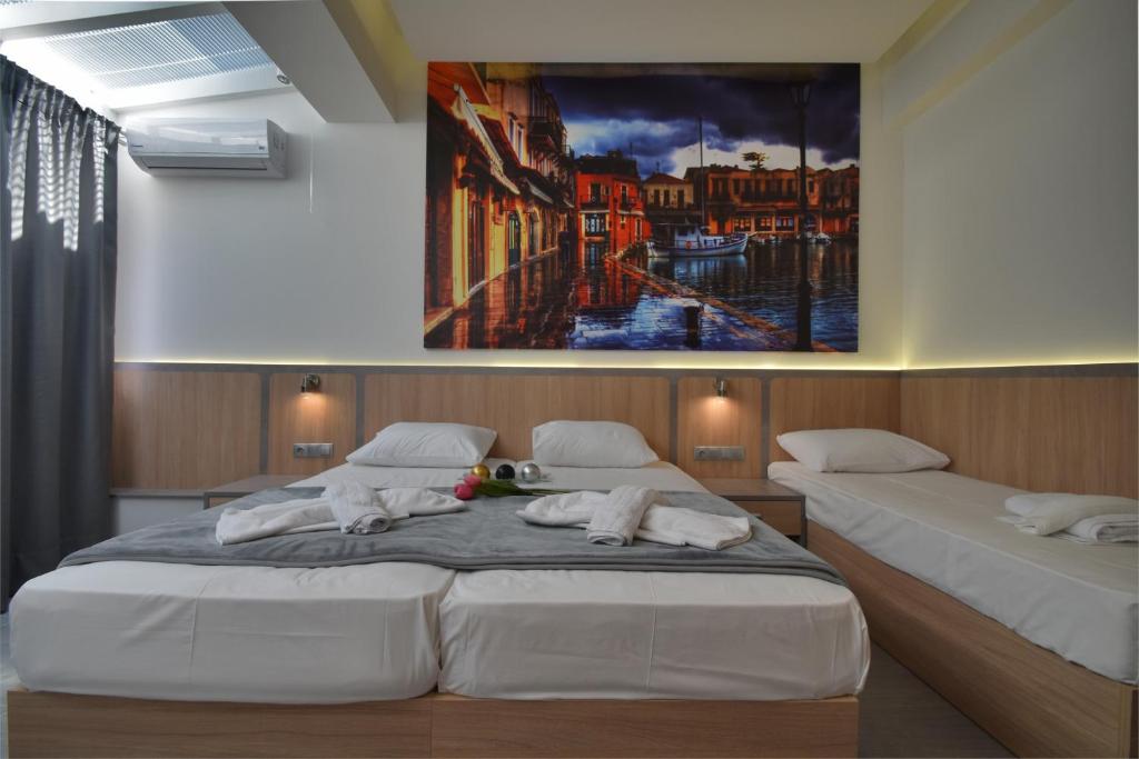 Postel nebo postele na pokoji v ubytování Dafni Plus Hotel