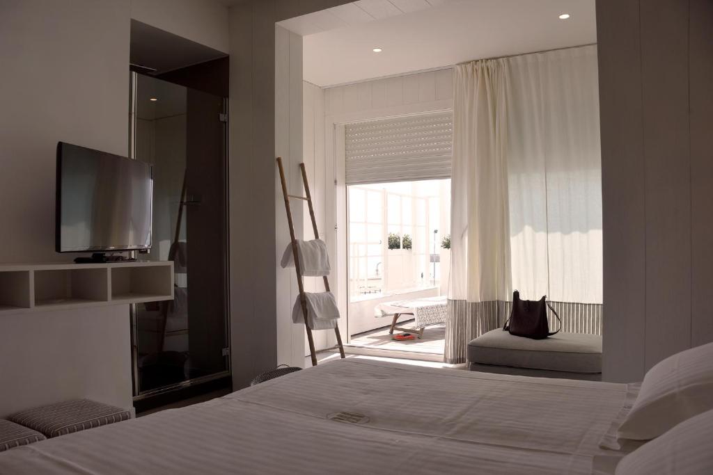 Postel nebo postele na pokoji v ubytování Hotel Ril