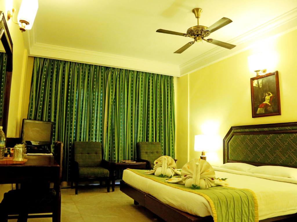 Postel nebo postele na pokoji v ubytování Anandha Inn Convention Centre and Suites