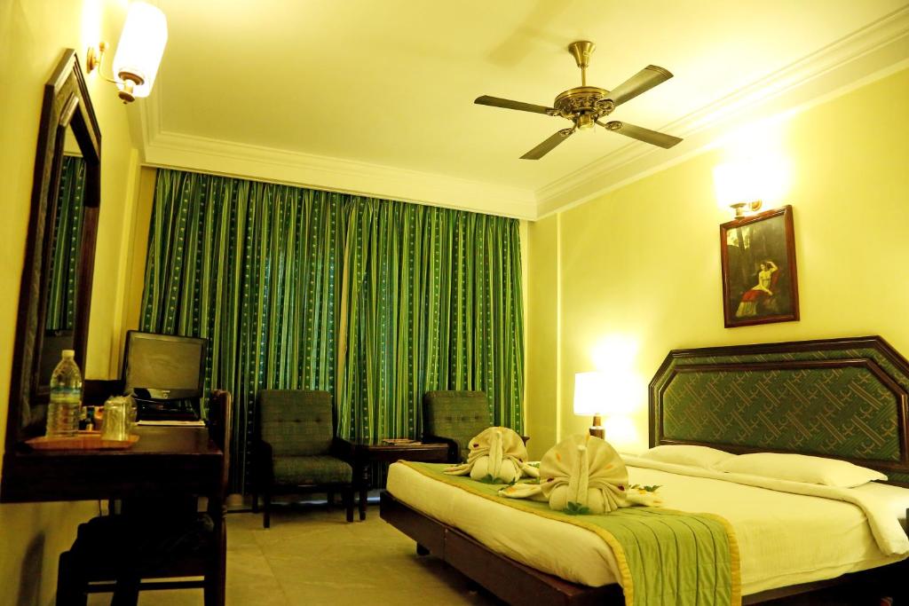 Postel nebo postele na pokoji v ubytování Anandha Inn Convention Centre and Suites