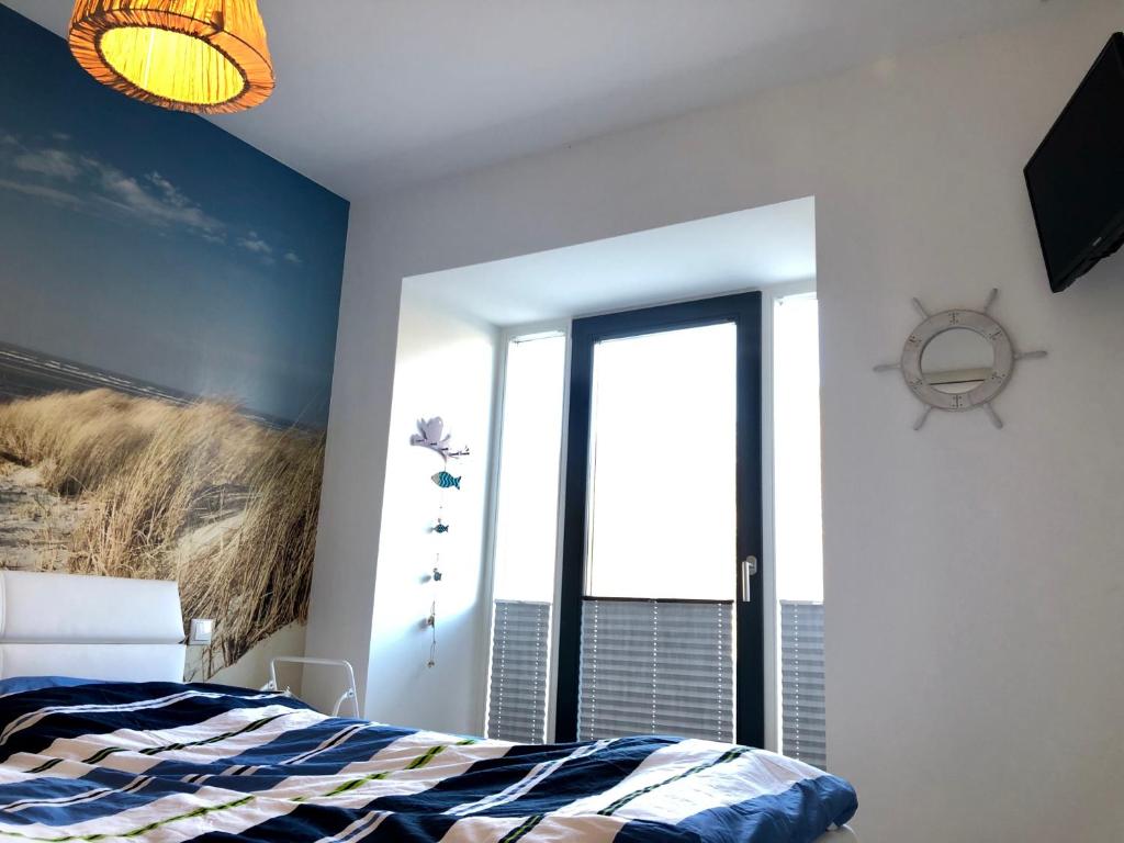 Postel nebo postele na pokoji v ubytování Strandapartment Meeresrauschen Prora Binz EG