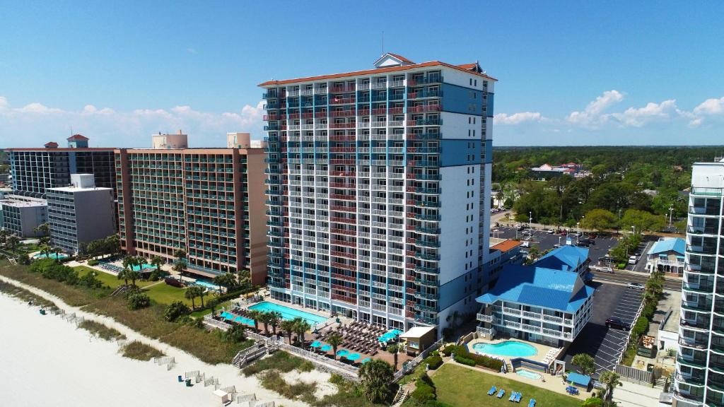 an aerial view of a large building with a pool at Paradise Resort in Myrtle Beach