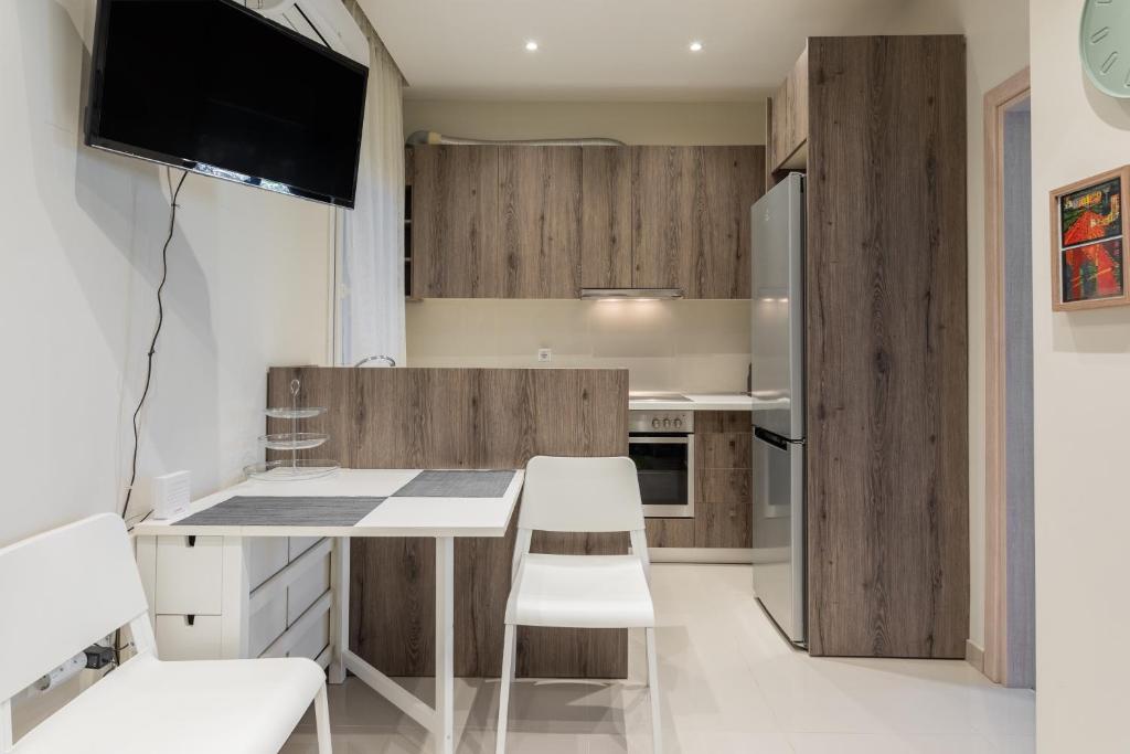 Kuchyň nebo kuchyňský kout v ubytování Cozy Apartment in City Center