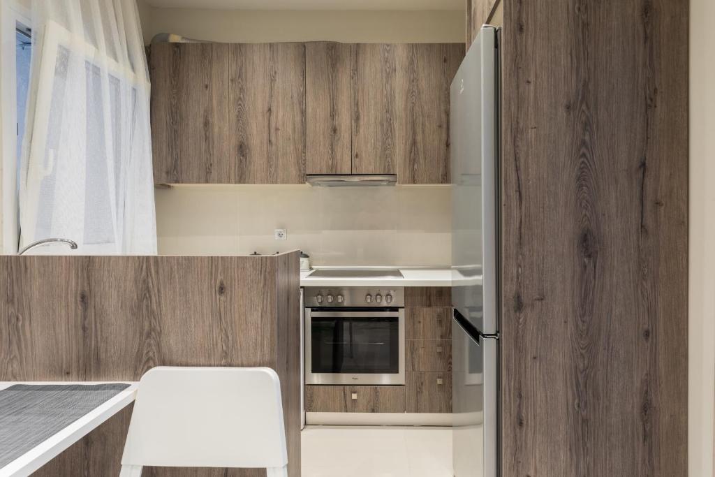 Kuchyň nebo kuchyňský kout v ubytování Cozy Apartment in City Center