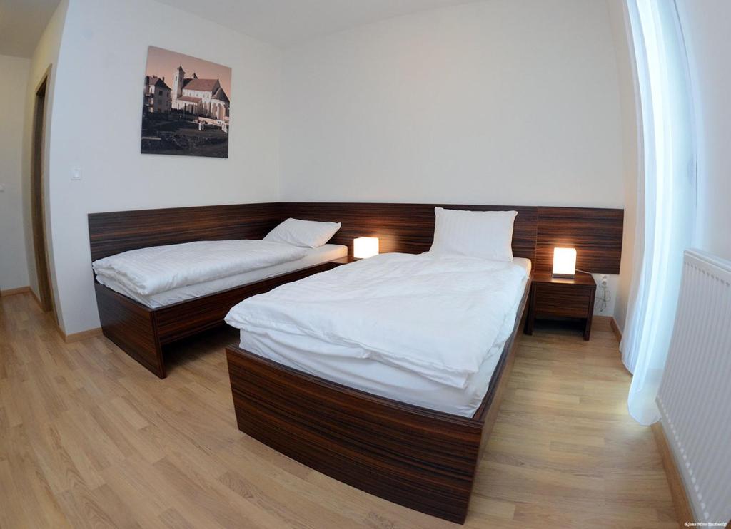 Postel nebo postele na pokoji v ubytování Hotel Bélier