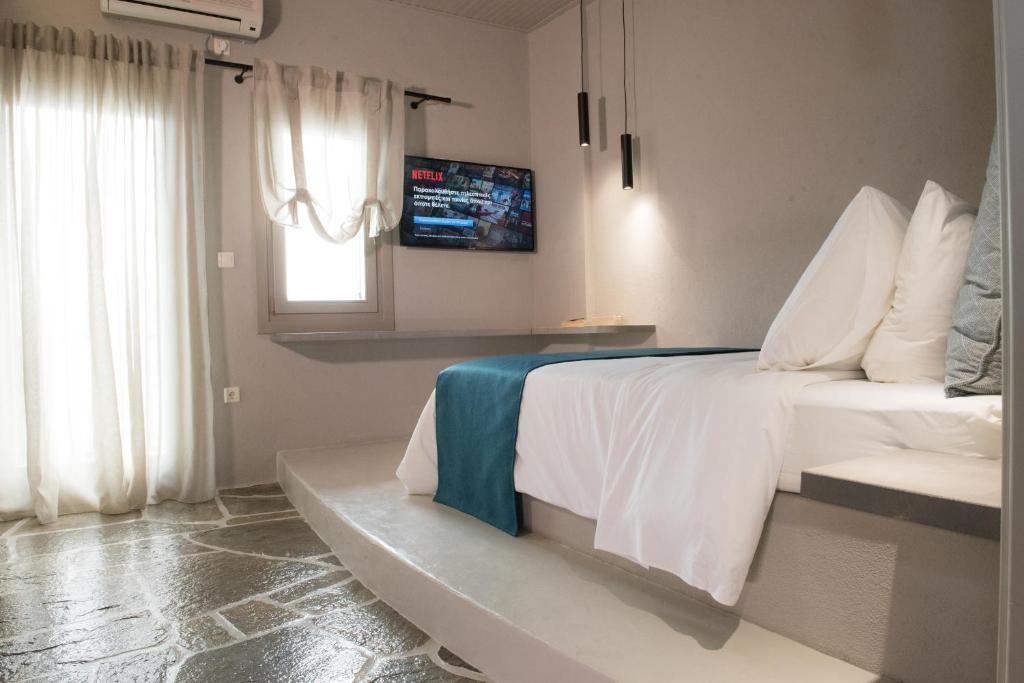 Postel nebo postele na pokoji v ubytování MELIES- Seaside Boutique Apartments