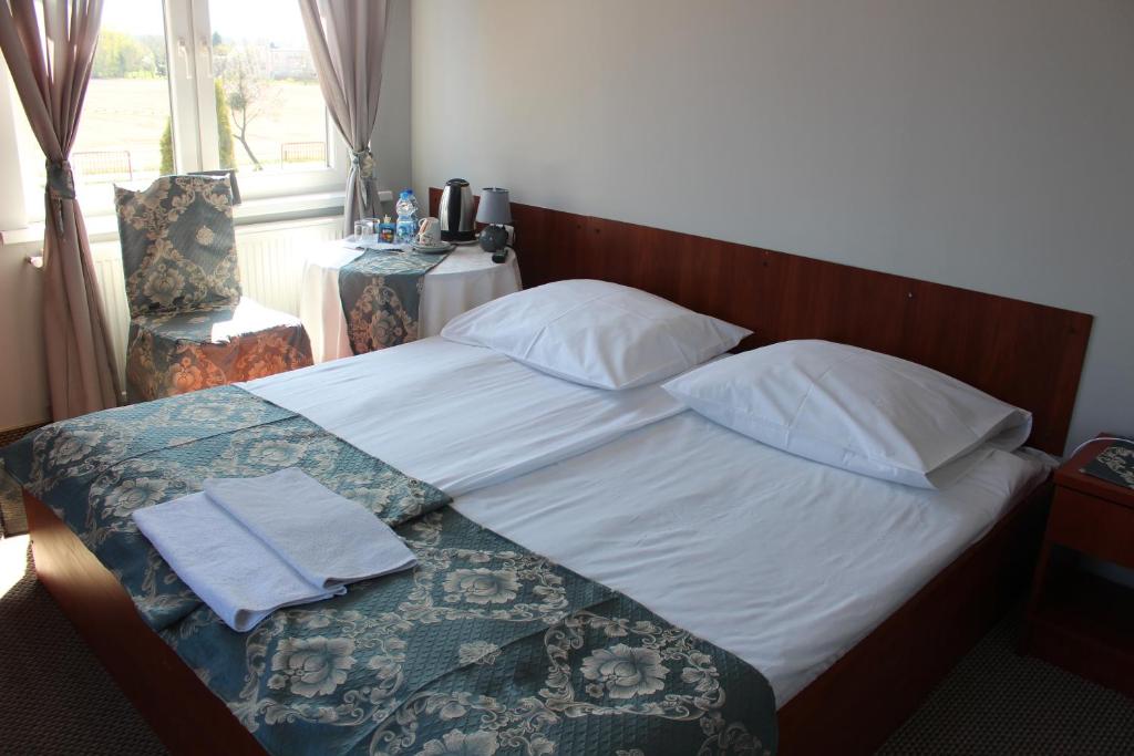 Posteľ alebo postele v izbe v ubytovaní Restauracja Hotel Kassandra