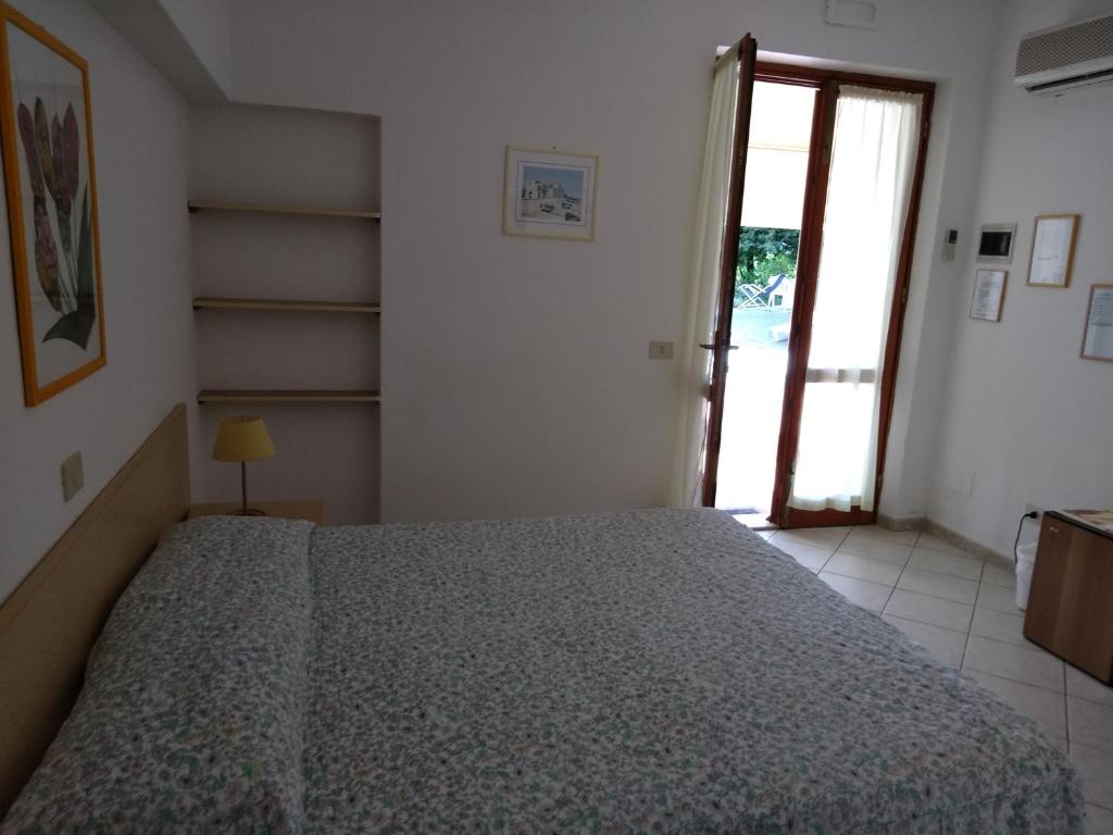 Postel nebo postele na pokoji v ubytování Villa dei Limoni