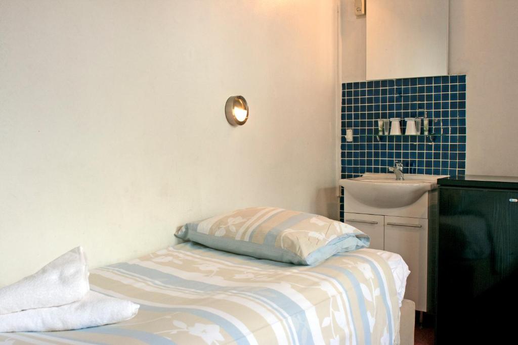 Postel nebo postele na pokoji v ubytování Hotel Torenzicht