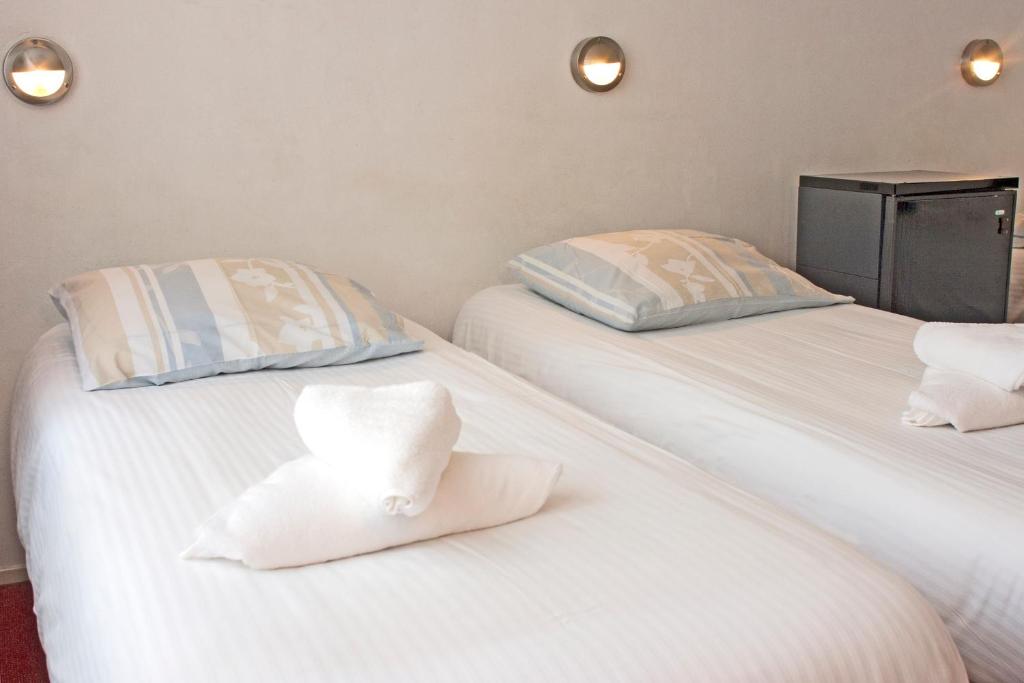 Postel nebo postele na pokoji v ubytování Hotel Torenzicht