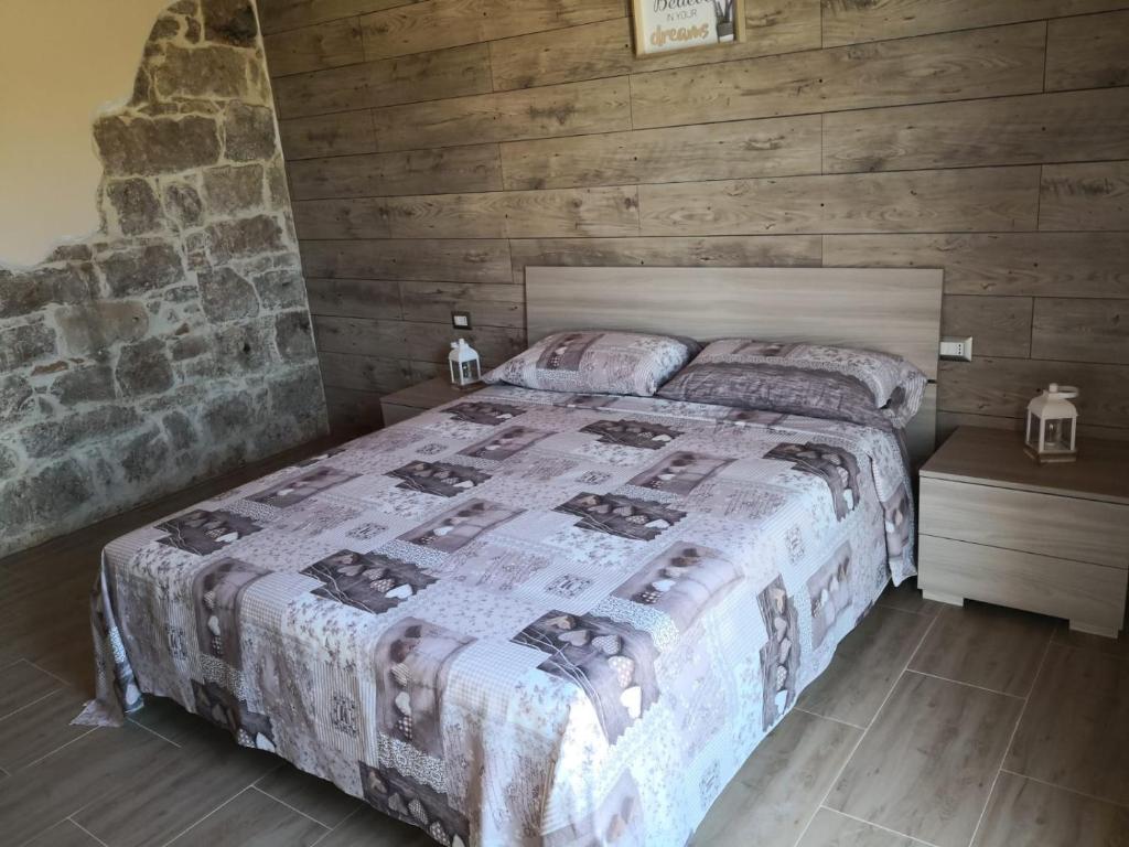 Postel nebo postele na pokoji v ubytování B&B GLI ULIVI