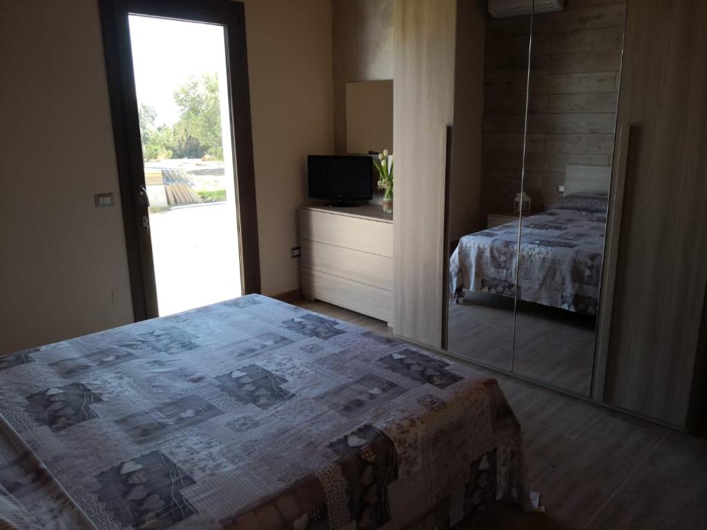 Postel nebo postele na pokoji v ubytování B&B GLI ULIVI