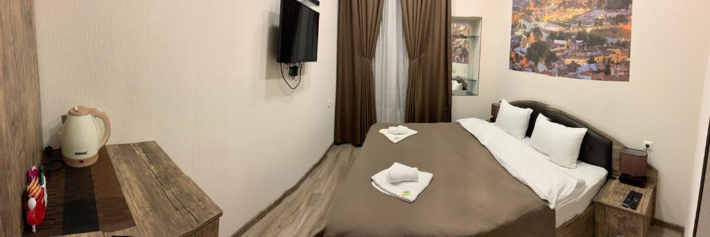 Postel nebo postele na pokoji v ubytování Sweet Rooms Inn