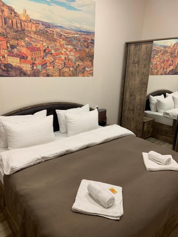 Postel nebo postele na pokoji v ubytování Sweet Rooms Inn