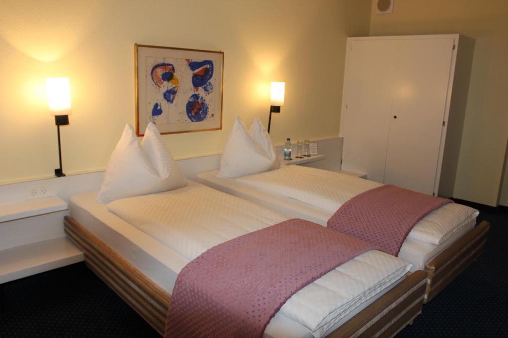 Voodi või voodid majutusasutuse Hotel Dufour toas