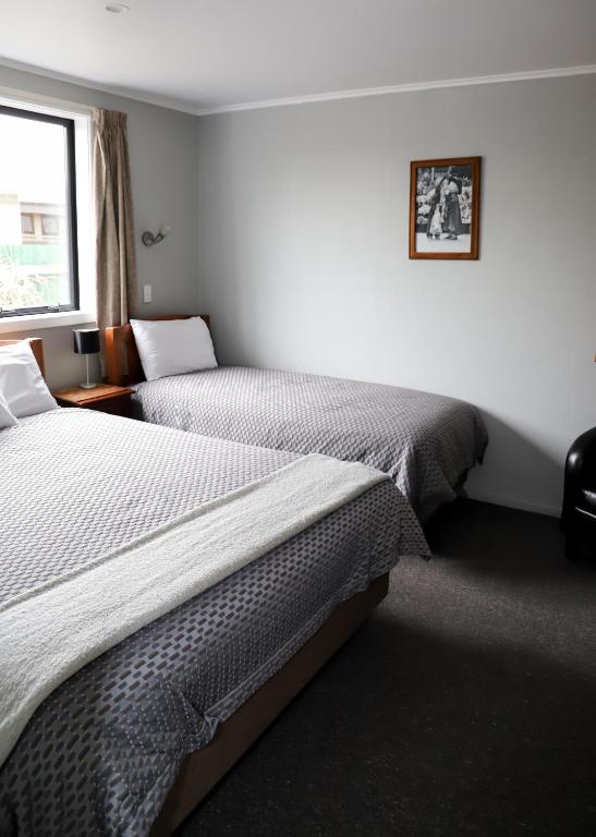 Postel nebo postele na pokoji v ubytování Coronation Park Motels
