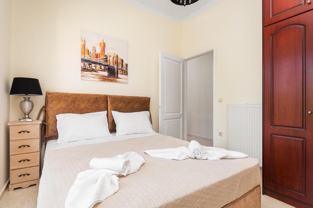 Posteľ alebo postele v izbe v ubytovaní michael apartments