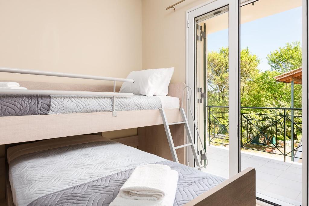 Posteľ alebo postele v izbe v ubytovaní michael apartments